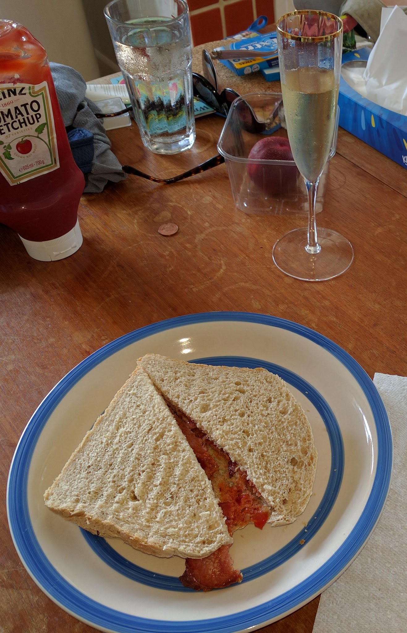 Tina's birthday. Bacon sandwich and a glass of Champagne. That's mah girl!